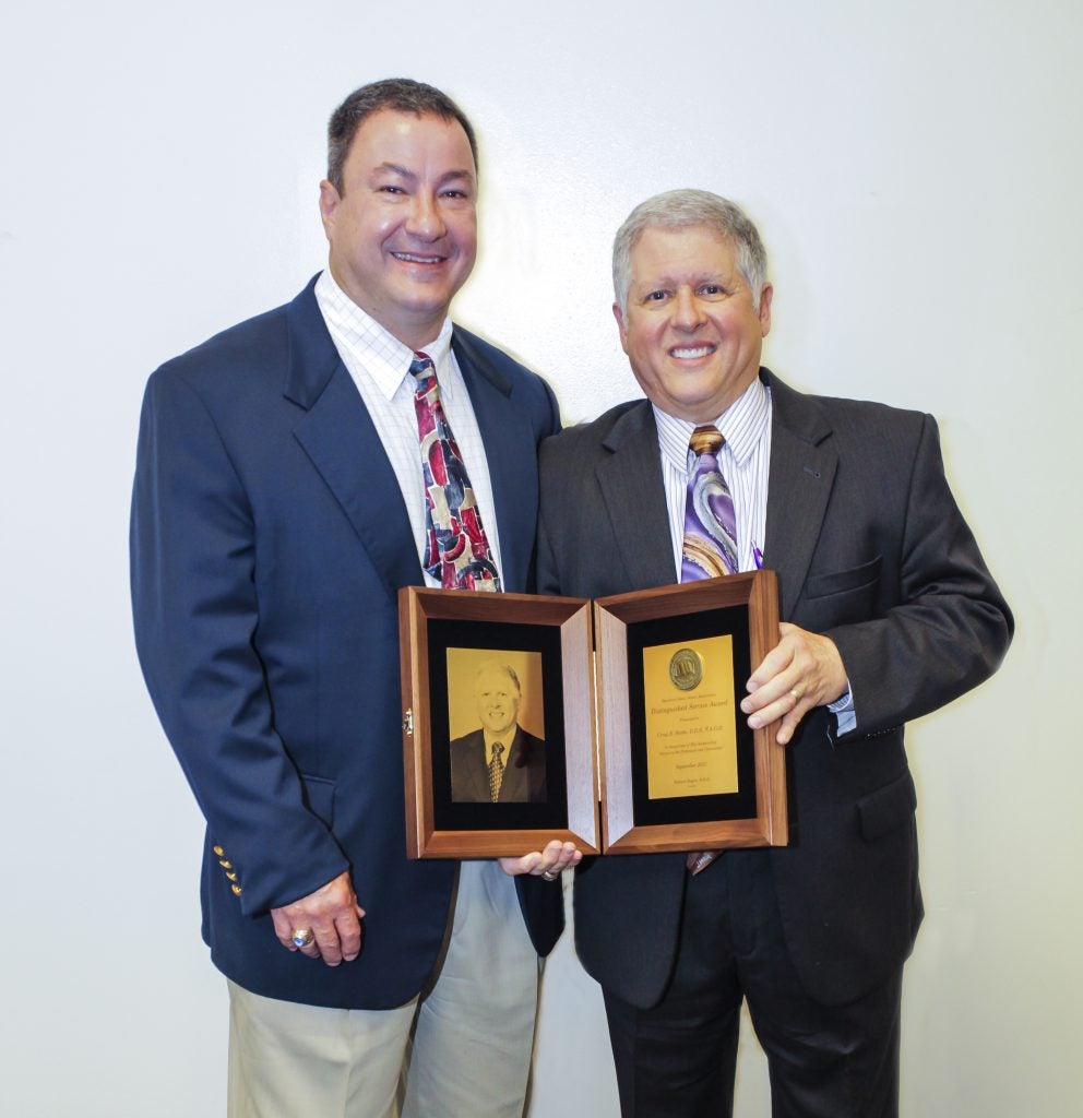 Dr. Craig Slotke (right) received the highest award given by organized dentistry in the State of Maryland. Dr. Kevin Doring presented the award at the Maryland State Dental Association Annual Meeting in September.