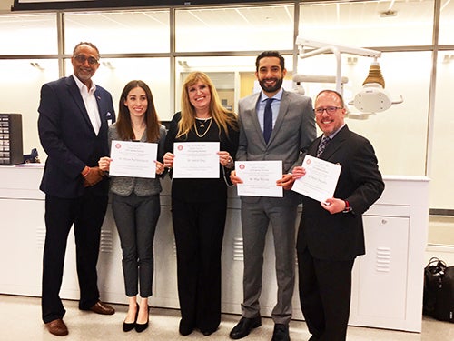 Old North State Dental Society president Dr. F. Vincent Allison, III (at left) thanked Dr. Acela Martinez Luna, Dr. Isabel Gay, Dr. Alex Gillone, and Dr. David Paquette for their participation in the workshop.