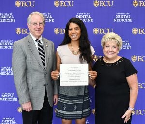 Briana Hudson ’20 received a scholarship from the Old North State Dental Society. Dean Greg Chadwick and Vice Dean Maggie Wilson presented the scholarship to Briana
