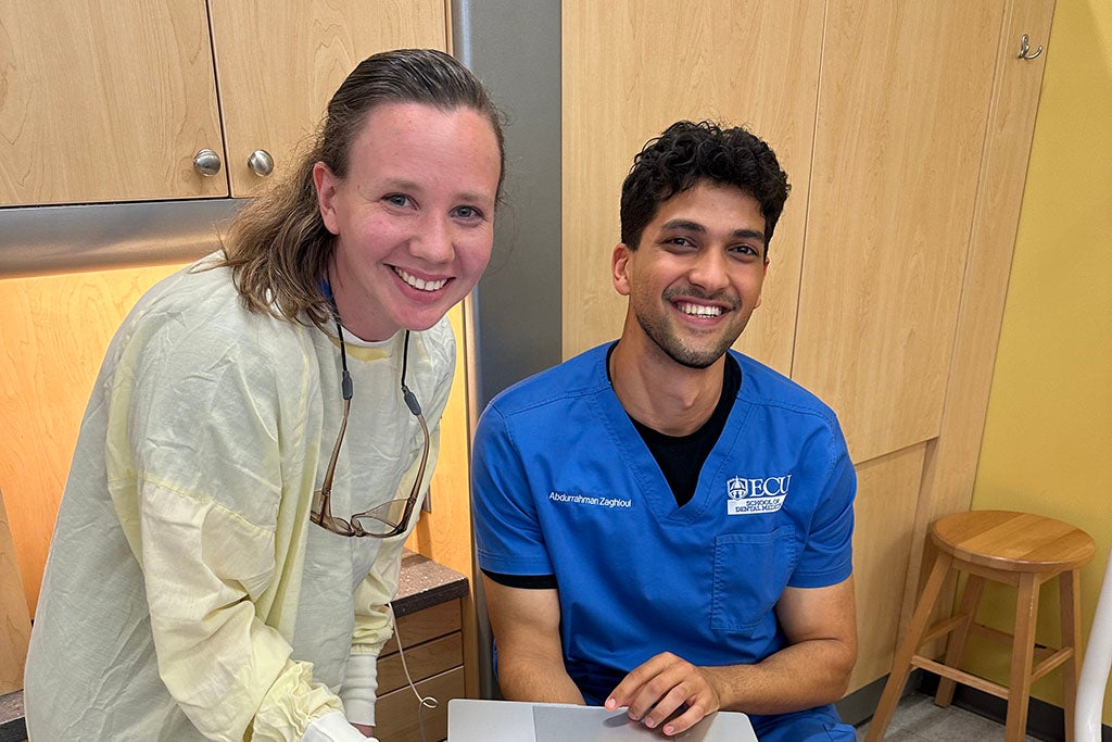 Two students in a dental clinic.